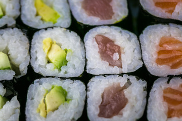Sushi and Sashimi rolls. Fresh made Sushi set with salmon, prawns, wasabi and ginger. Traditional Japanese cuisine