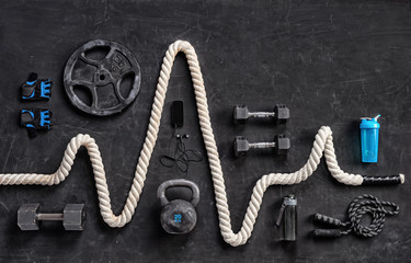 Sports equipment on a black background. Top view. Motivation