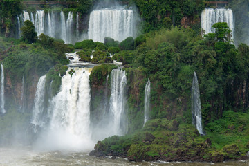Fototapeta premium Cascade of Iguazu Falls, One of the New Seven Wonders of Nature, in Brazil and Argentina
