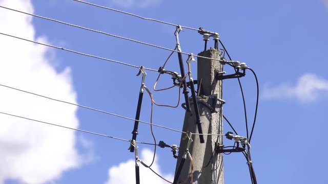 Portable grounding. Temporary grounding of power lines. Grounding power lines. The power lineman use clamp stick (insulated tool) to closing a transformer on energized high-voltage electric power line