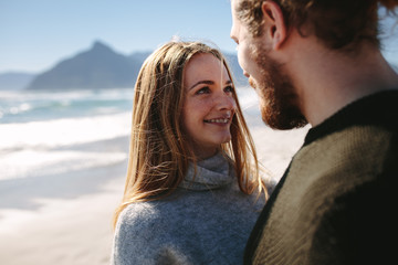 Loving couple along the seashore on a summer day