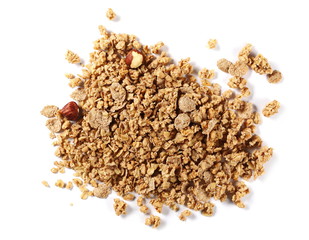 Crunchy granola, muesli pile with nuts isolated on white background, top view