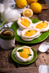 egg shaped meringue nests with lemon curd.traditional easter pastries.
