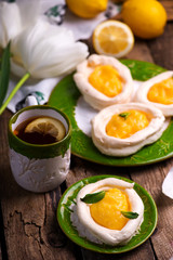egg shaped meringue nests with lemon curd.traditional easter pastries.