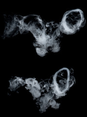Smoke rings on black background - 239064301