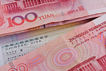 Chinese visa in passport and yuans