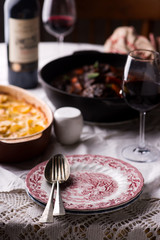 Beef cheeks in red wine with carrots and potato gratin.