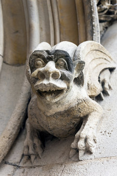 Gargoyles on the wall of a medieval building.