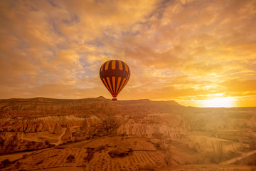 Hot air balloon flying over spectacular Cappadocia