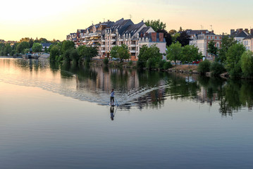 Fototapeta na wymiar Banks of the Mayenne river, City of Laval, Mayenne, Pays de Loire, France. August 5, 2018