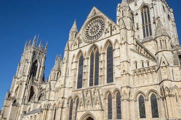 Fototapeta na wymiar Gothic minster against a bright blue sky