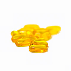 Yellow fish oil capsules isolated on white background. Omega 3 concept: health