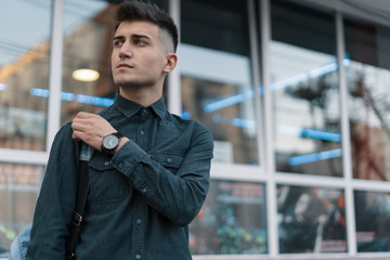 Portrait young man on blurred city background