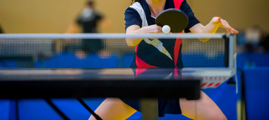 close up of a table tennis player returning - obrazy, fototapety, plakaty