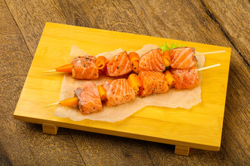 Raw salmon skewer