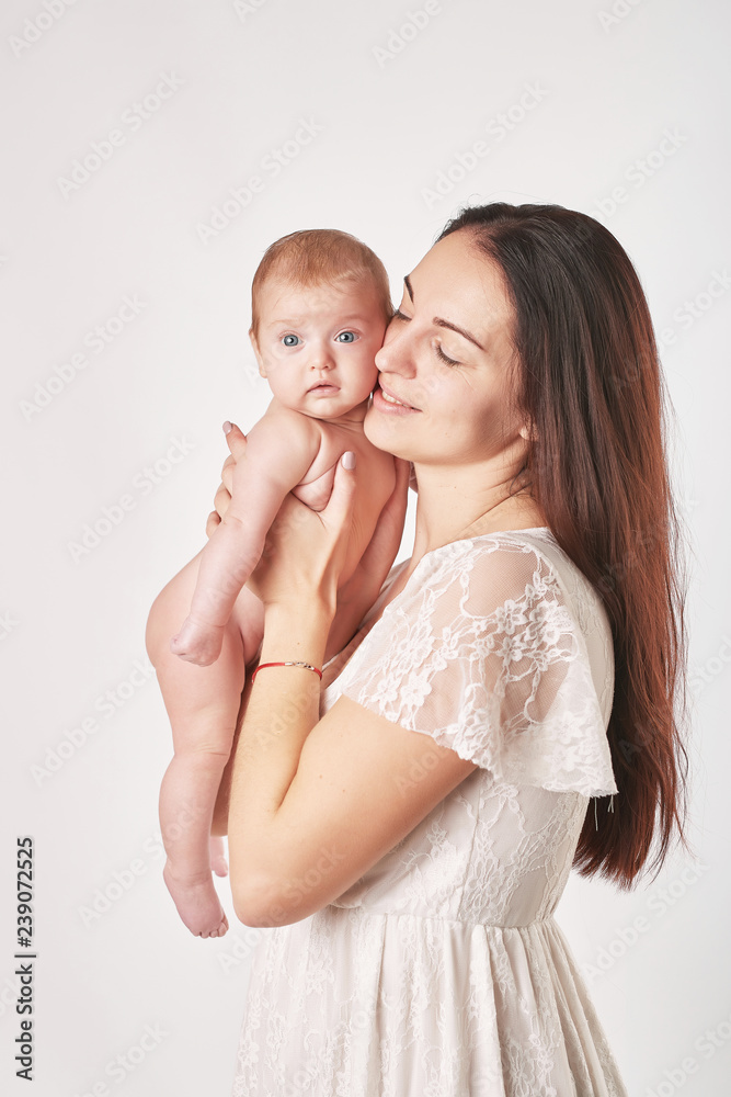 Wall mural portrait happy smiling mother with baby on white background. happy smiling mother with baby having f