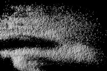 Pile of shredded coconut meat isolated on black background, top view