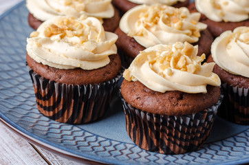 Chocolate cupcakes with caramel crea.
