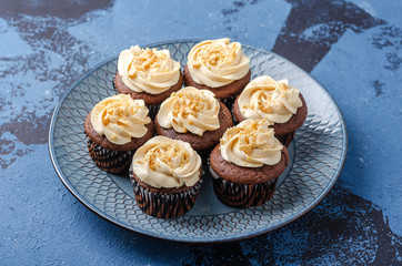 Chocolate cupcakes with caramel crea.