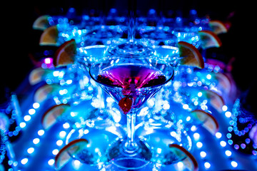 glass of water neon cocktail drink