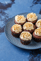 Chocolate cupcakes with caramel crea.