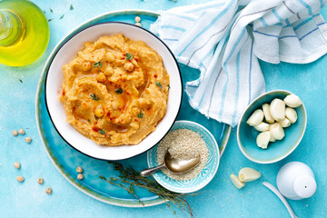 Hummus with chickpea and tahini, delicious and healthy protein vegan and vegetarian food, top view, flat lay.