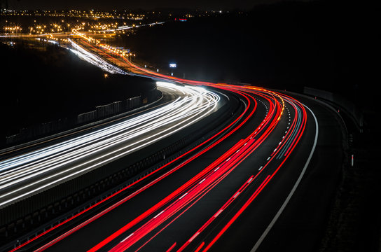 White And Red Car Light Trails On Motorway Junction