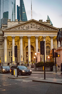 Black taxi cars before royal exchange building