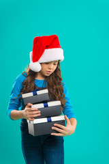 Happy winter holidays. Small girl. Present for Xmas. Childhood. Christmas shopping. Little girl child in santa hat. New year party. Santa claus kid. holidays preparations