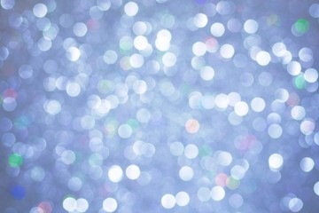 Christmas lights silver background. Bokeh abstract texture