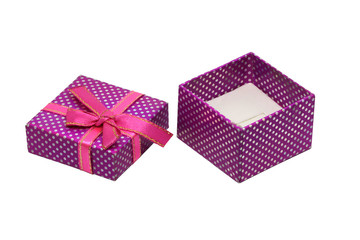 Purple gift box with white dots and red ribbon with bow, isolated on white background.