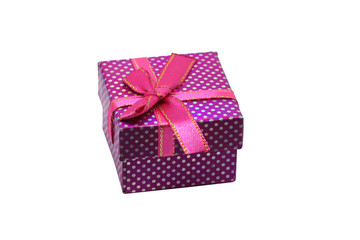 Purple gift box with white dots and red ribbon with bow, isolated on white background.