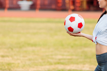 soccer ball in hand. copy space. close-up. football game concept.