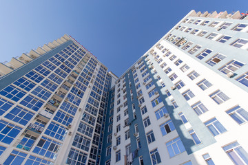 Tall and wide house against the sky