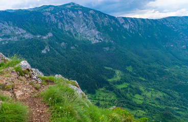 Naklejka premium The picturesque village is located among the deep canyon.