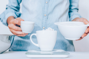 Close-up flour in white cup