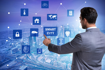 Concept of smart city with businessman pressing buttons