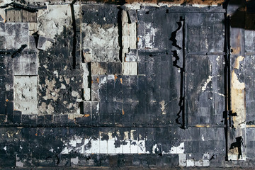Charred tiled wall concrete background