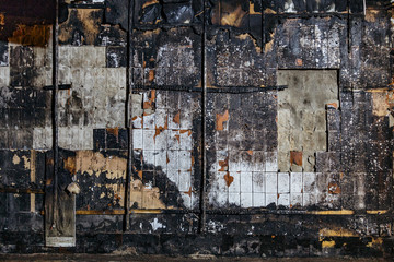 Charred tiled wall background