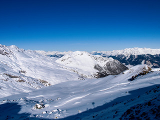 Savognin: region, snow-covered mountains and ski slopes