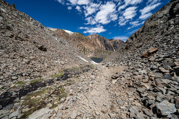 Dangerous trail of loose scree and talus along the 20 Lakes Basin trail to Helen Lake in Sierra Nevada Mountains of California