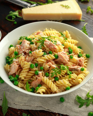 Homemade Pasta fusilli with salmon, green peas, parmesan cheese and lemon. healthy food