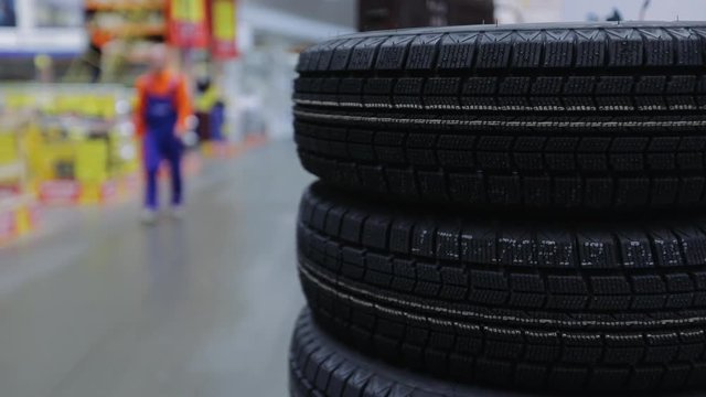 Winter tires for sale at a tire store, slow motion video