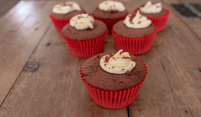 Close up of a red velvet cup cake with Cream Cheese frosting