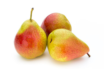 Fresh bio pear with leaves on isolated white background.