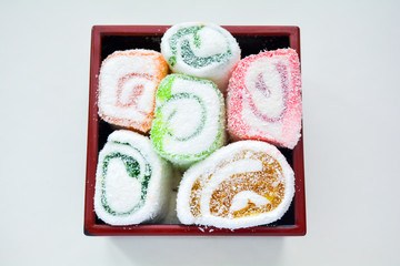 Delicious rolls of Lokum with fruit marmalade in japanese style in black box