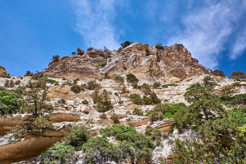 Cyprus. Peyia Avakas gorge. Rocks hover over the tourist trail