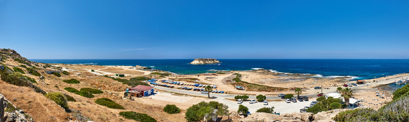 Fototapeta na wymiar Cyprus. Peyia Cape Drepano. Panorama of the coast with the island of Kionas