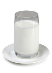 Glass pitcher with milk on white background