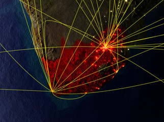South Africa from space on model of planet Earth with networks. Detailed planet surface with city lights.